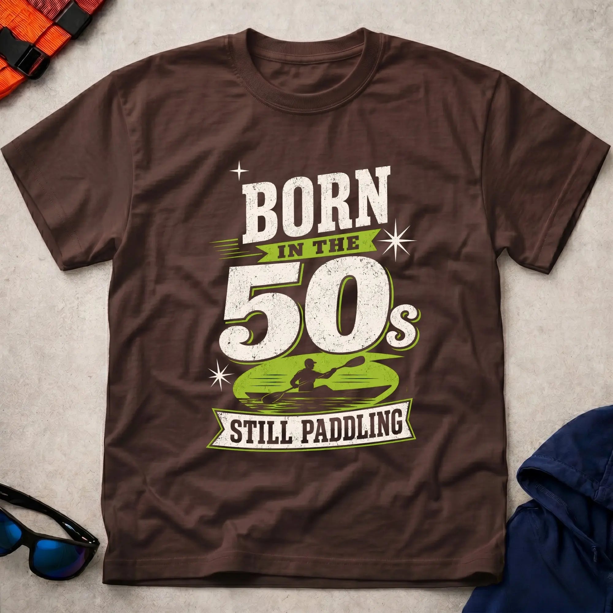 Born In The 50s – Still Paddling kayaker typography tee in Dark Chocolate | Vector Paddle