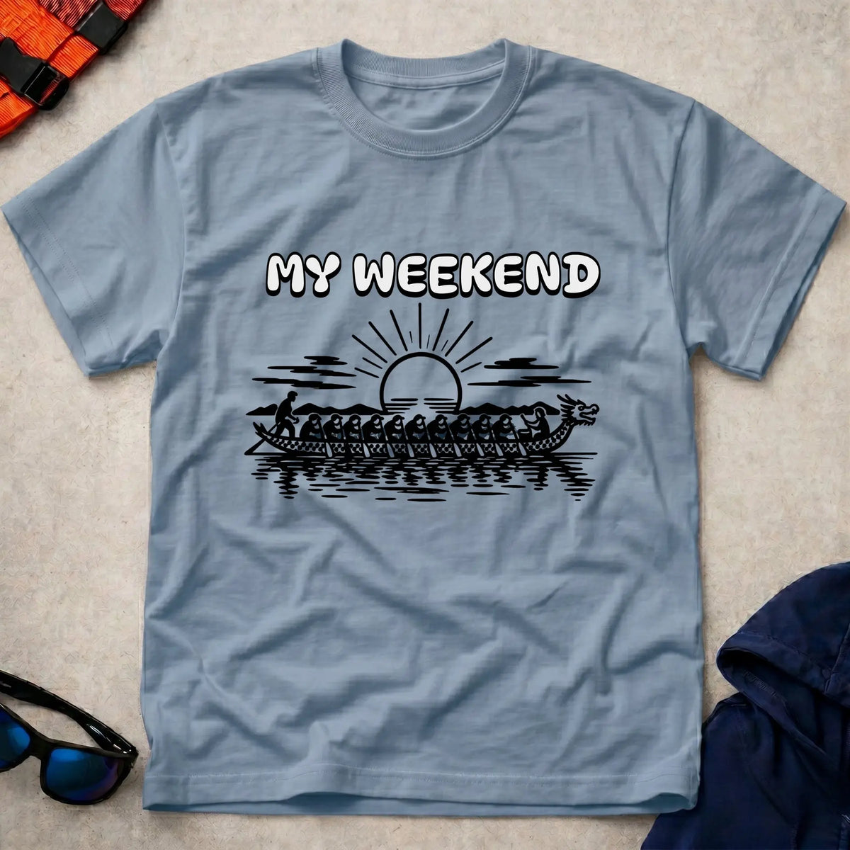 My Weekend Dragon Boat tee in Light Blue — dragon boat crew at sunrise with 'My Weekend' lettering — Vector Paddle