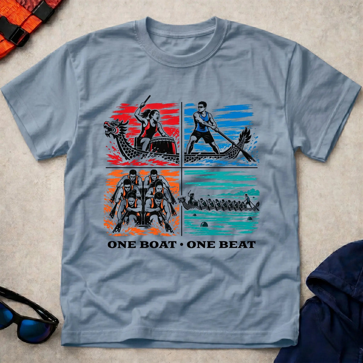 One Boat, One Beat tee in Light Blue — four-panel dragon boat design with drummer, steerer, engine room and full crew — Vector Paddle