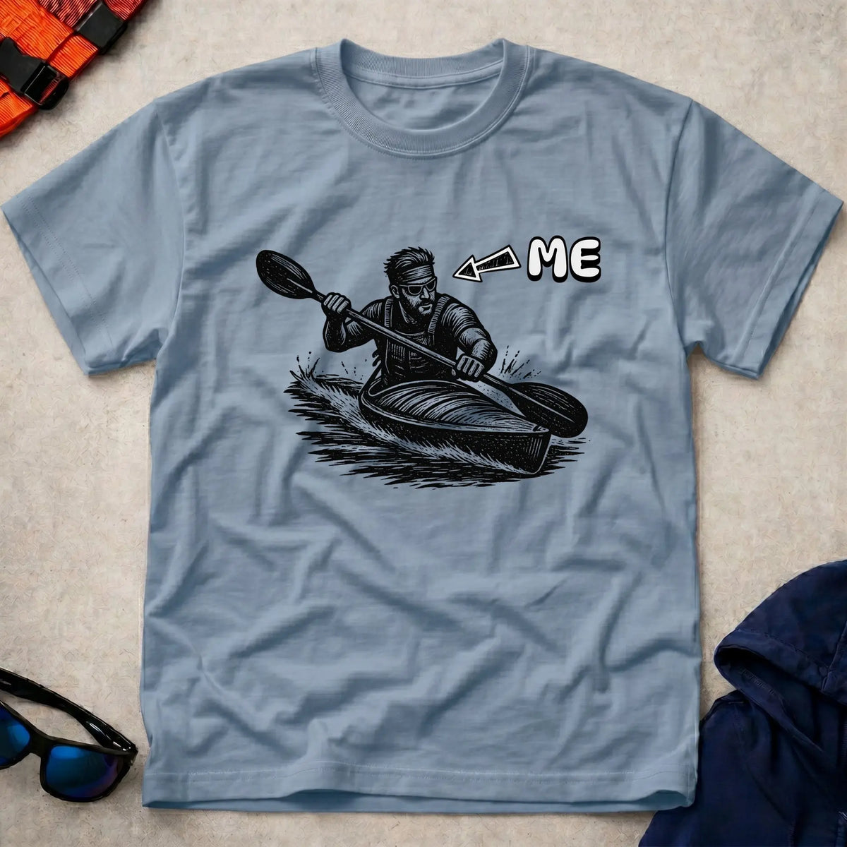 That's Me K1 tee in Light Blue — woodcut kayaker in headband and shades with 'ME' arrow — Vector Paddle