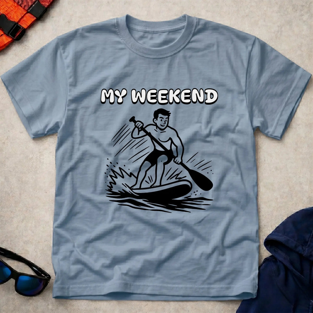My Weekend SUP tee in Light Blue — cartoon stand-up paddleboarder with 'My Weekend' lettering — Vector Paddle