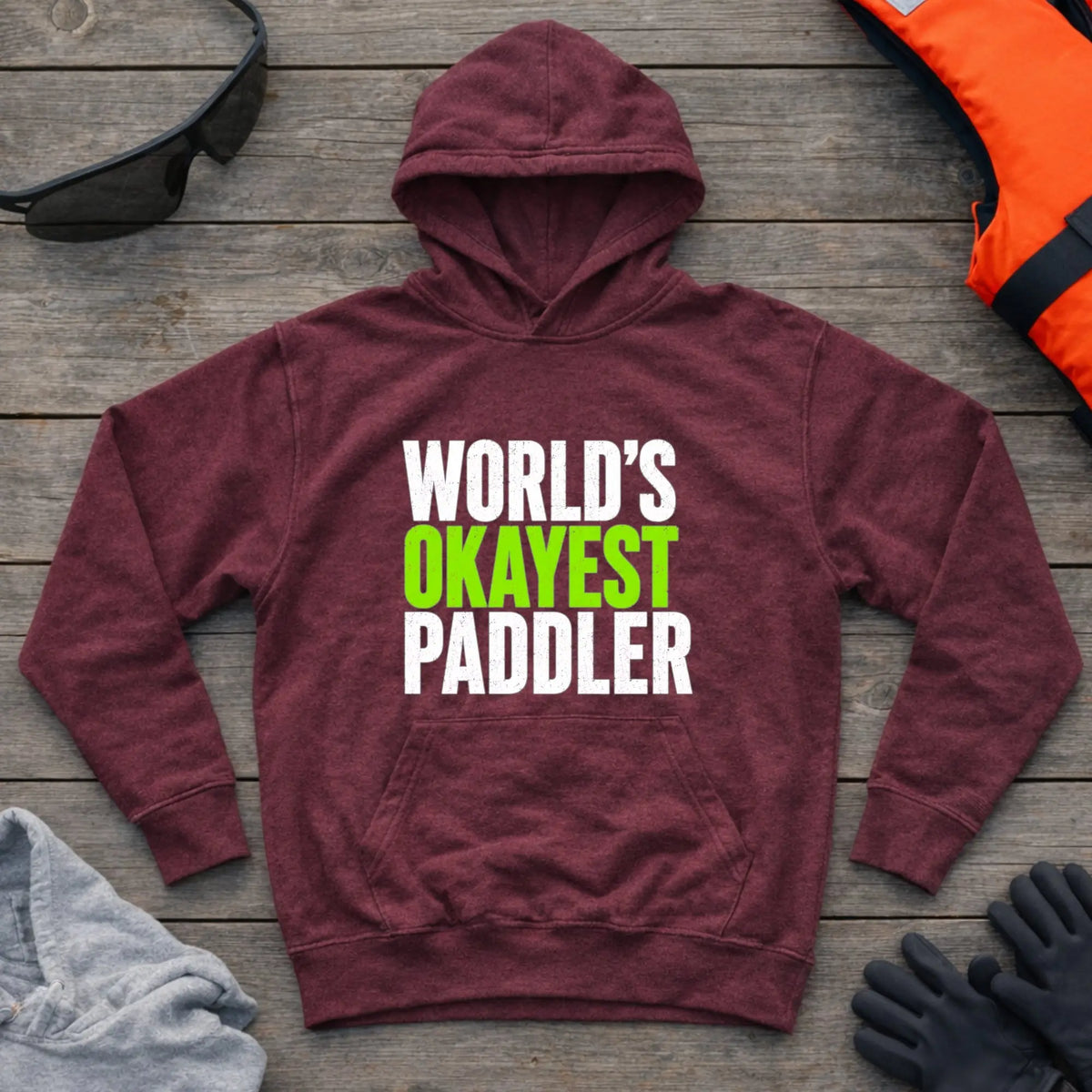 World's Okayest Paddler hoodie in Maroon — funny self-deprecating paddling slogan — Vector Paddle