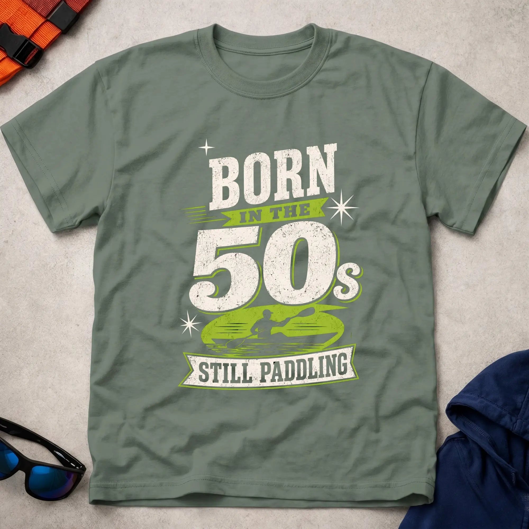 Born In The 50s – Still Paddling kayaker typography tee in Military Green | Vector Paddle