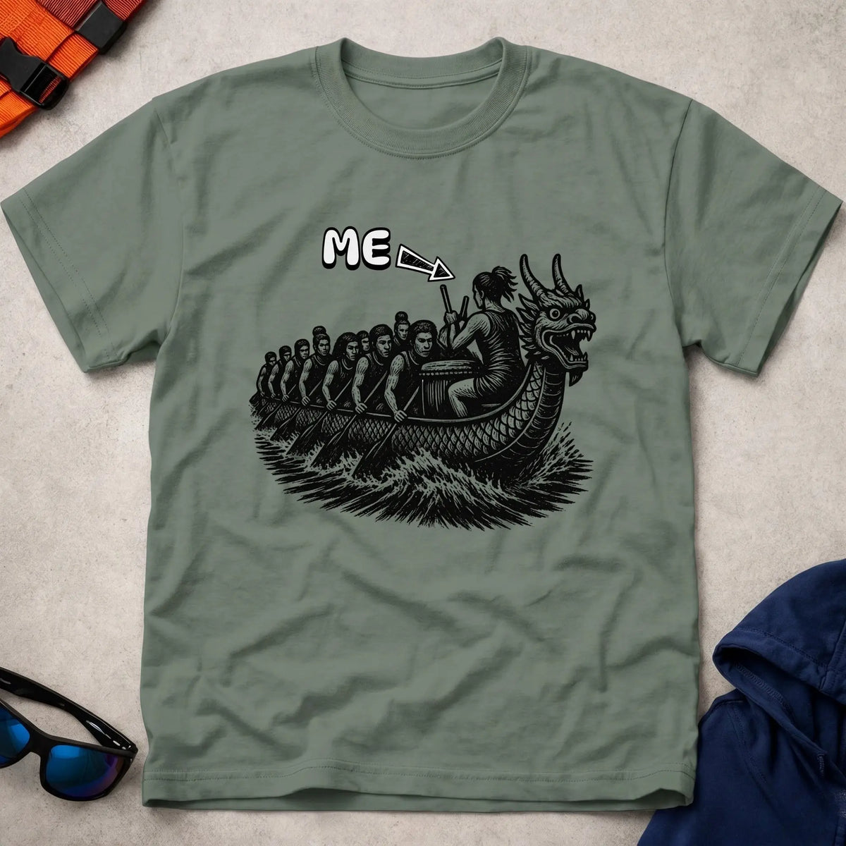 That's Me Drummer tee in Military Green — woodcut dragon boat with 'ME' arrow on the drummer — Vector Paddle