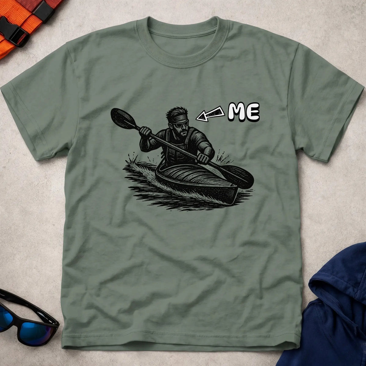 That's Me K1 tee in Military Green — woodcut kayaker in headband and shades with 'ME' arrow — Vector Paddle