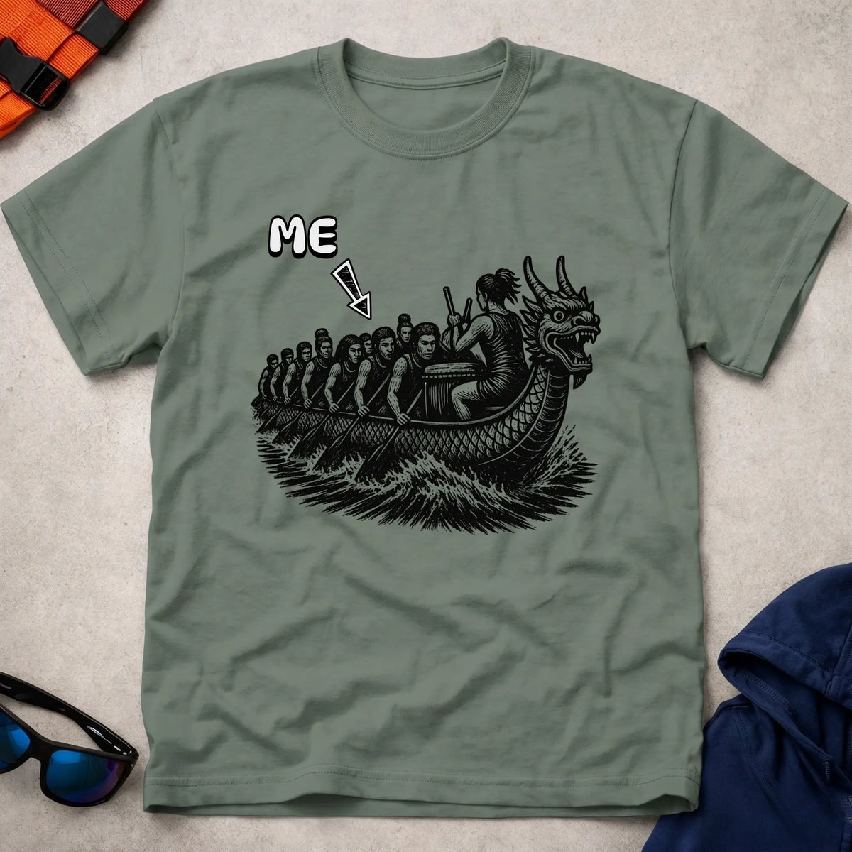 That's Me Engine Room tee in Military Green — woodcut dragon boat with 'ME' arrow on a mid-boat paddler — Vector Paddle