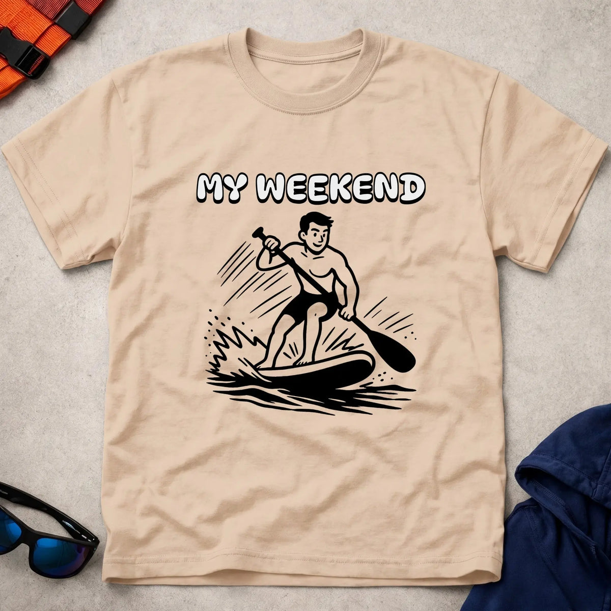 My Weekend SUP tee in Natural — cartoon stand-up paddleboarder with 'My Weekend' lettering — Vector Paddle