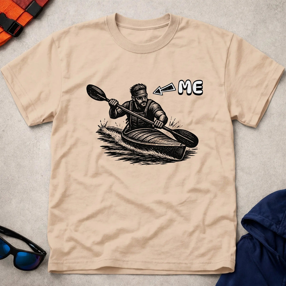That's Me K1 tee in Natural — woodcut kayaker in headband and shades with 'ME' arrow — Vector Paddle