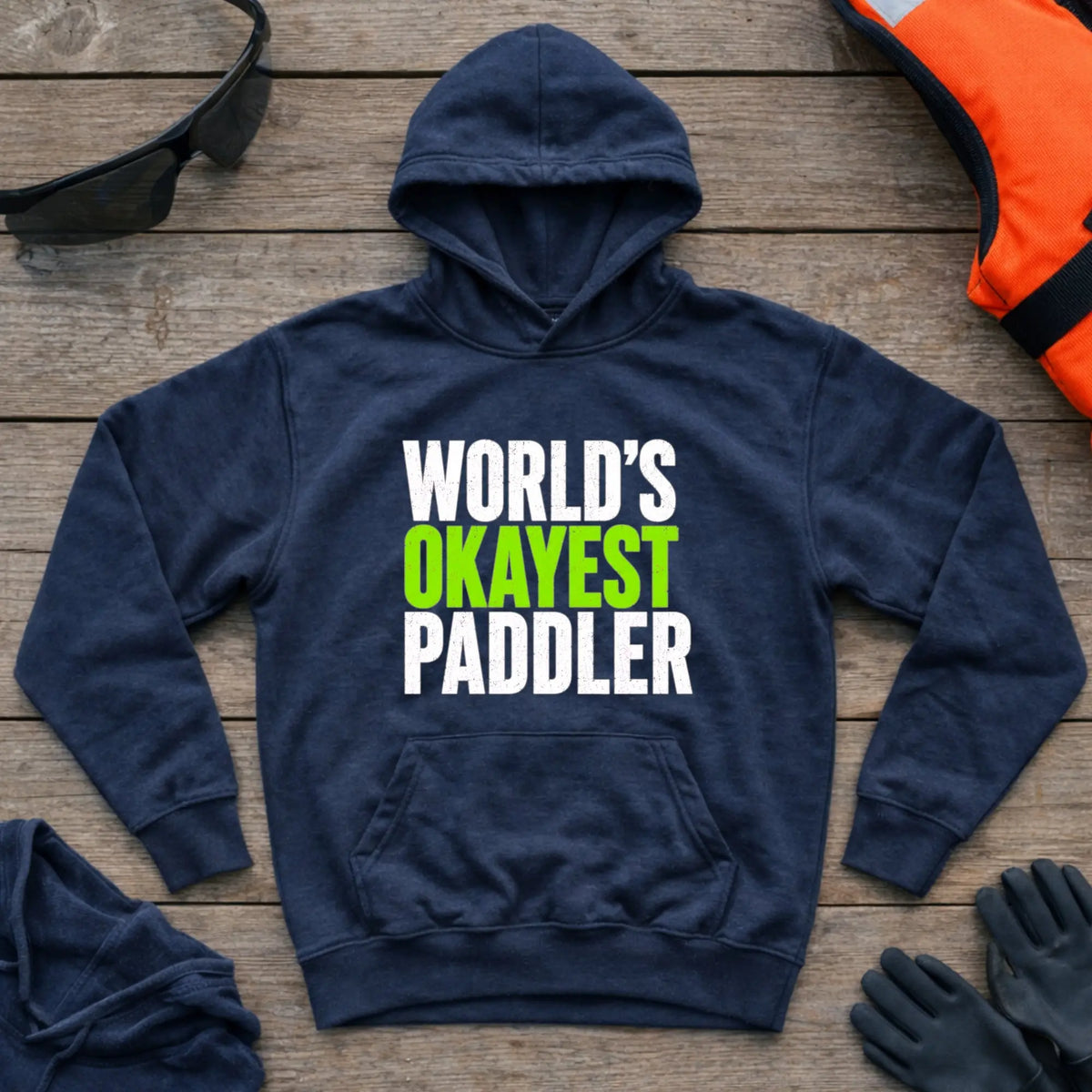 World's Okayest Paddler hoodie in Navy — funny self-deprecating paddling slogan — Vector Paddle