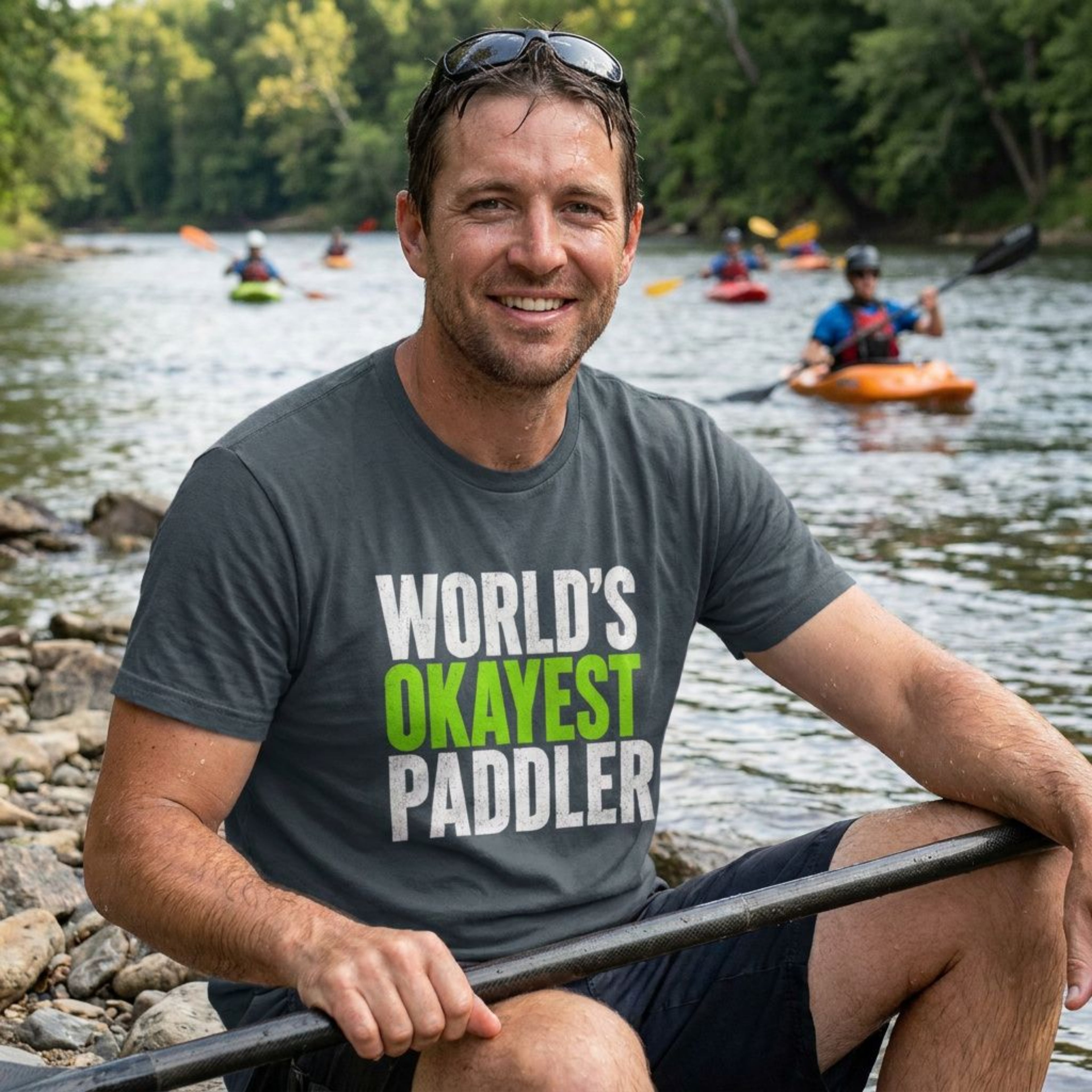 Paddler wearing a Vector Paddle tee by the river – lifestyle apparel for kayakers and canoeists