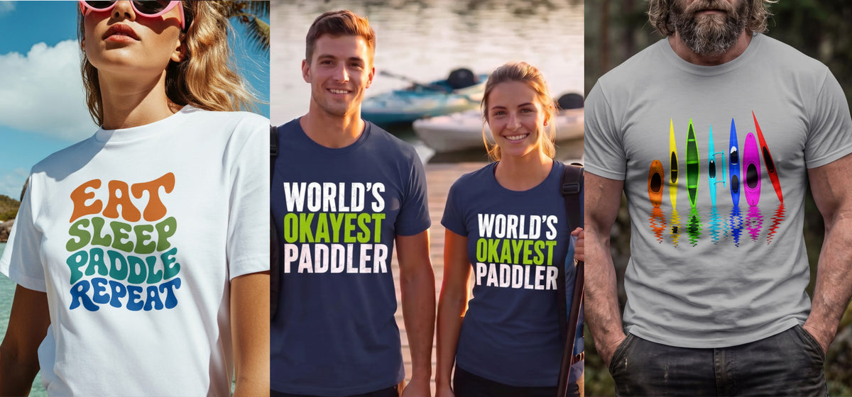 Three Vector Paddle tees worn outdoors: Eat Sleep Paddle Repeat on white, World’s Okayest Paddler on navy, and a rainbow kayak reflection design on grey
