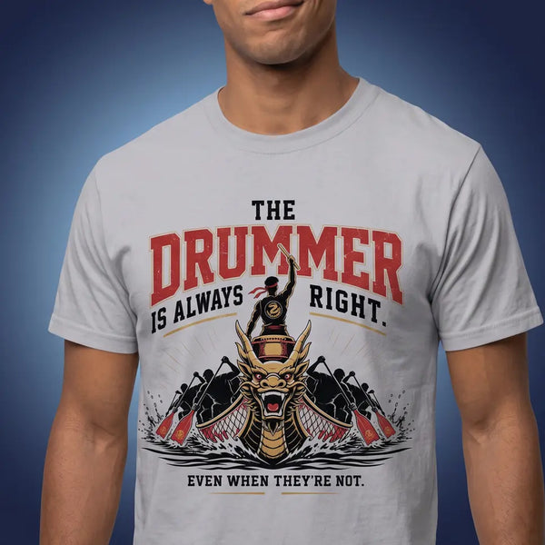 A man wearing a light gray crew-neck t-shirt with a graphic print that reads 'THE DRUMMER IS ALWAYS RIGHT.' in red and black, featuring a stylized dragon boat illustration.